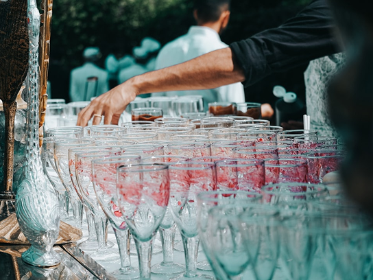 Wine glasses lined up for an event